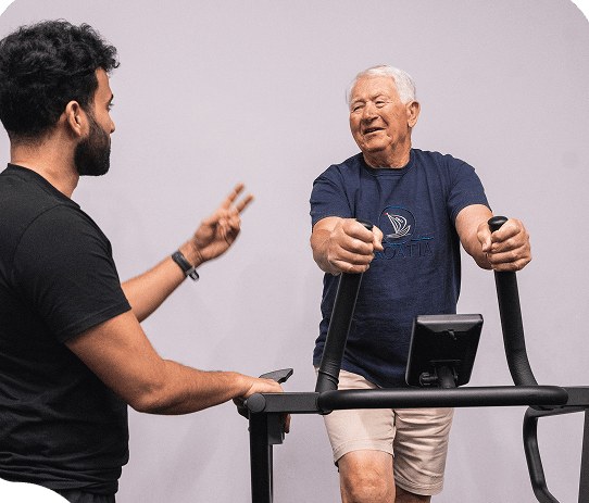 Coach guiding a client on the treadmill